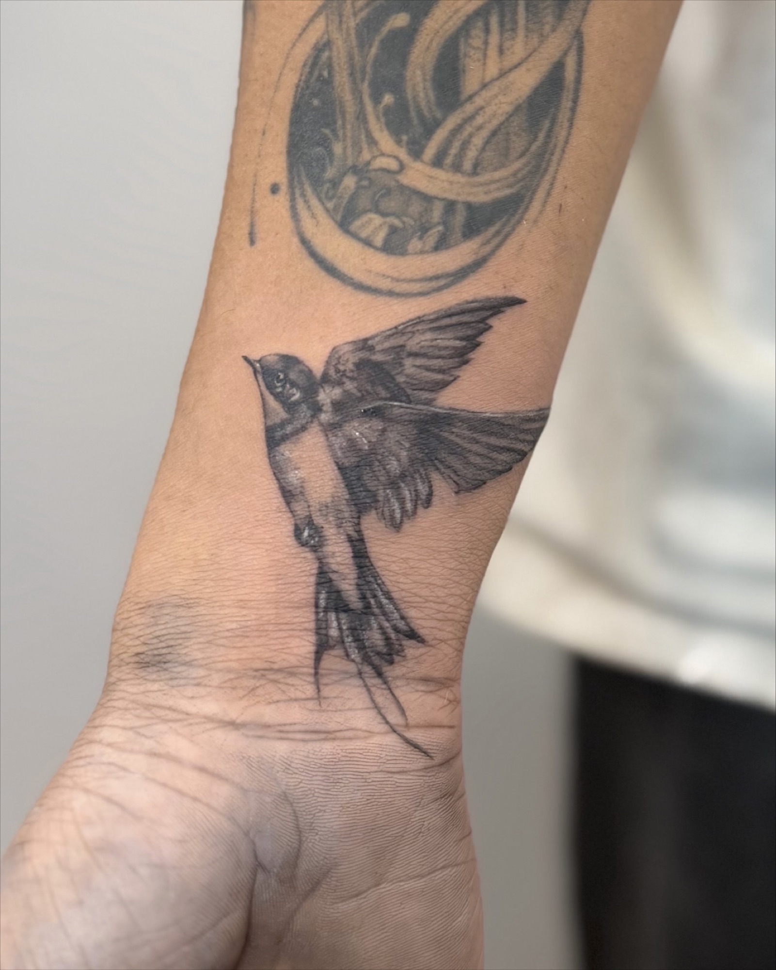 HIM black and grey figure tattoo